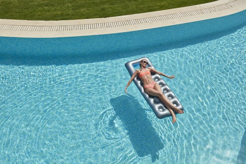 Elissa Adults-Only Lifestyle Beach Resort Kallithea  Bagian luar foto A woman on a pool float